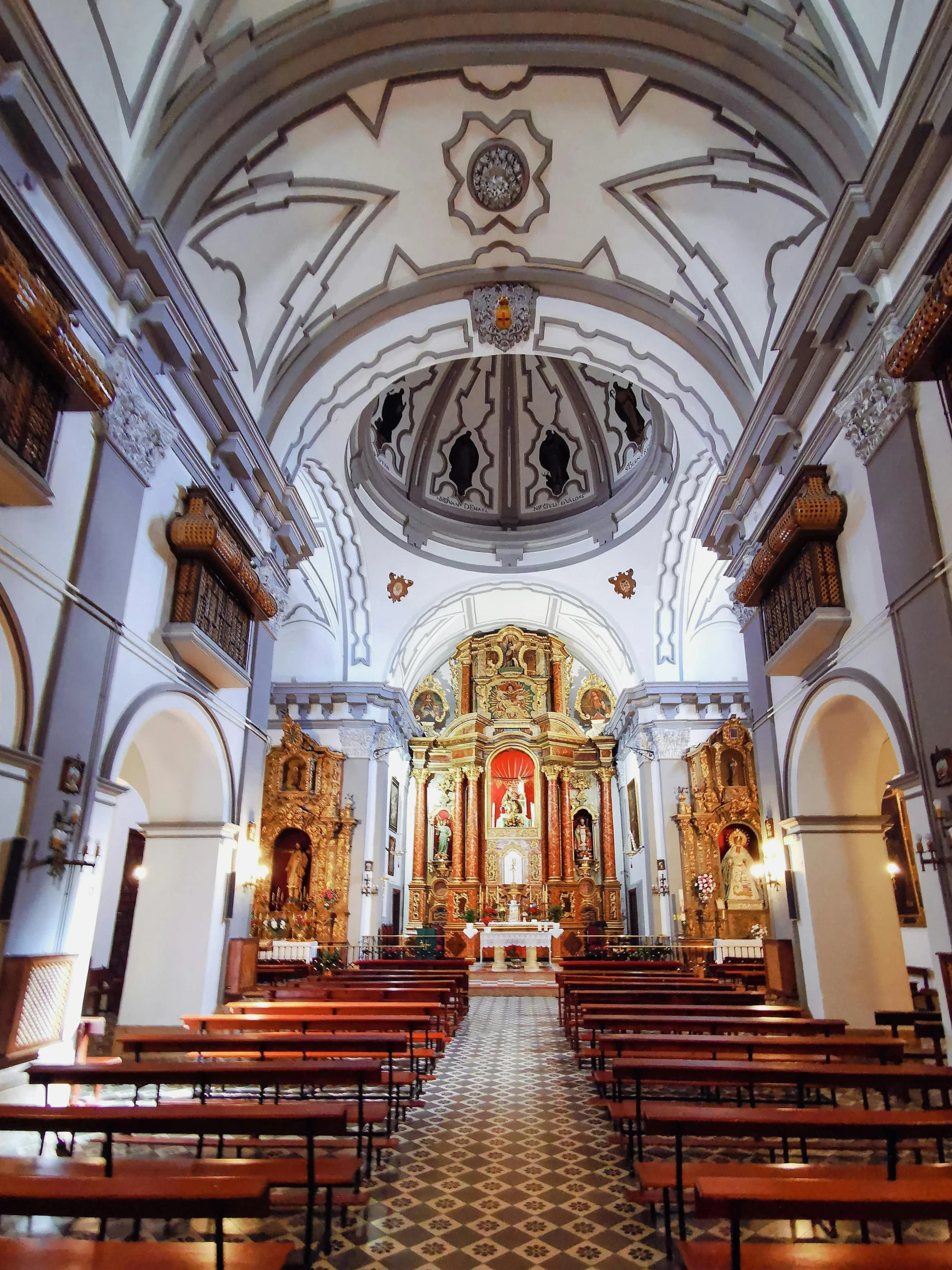 an inside s of a cathedral with pews