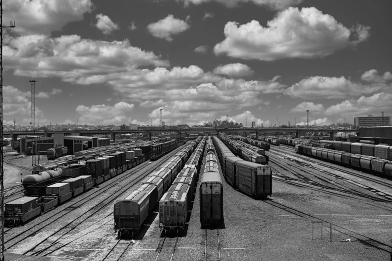 several freight cars sit next to each other at a train yard