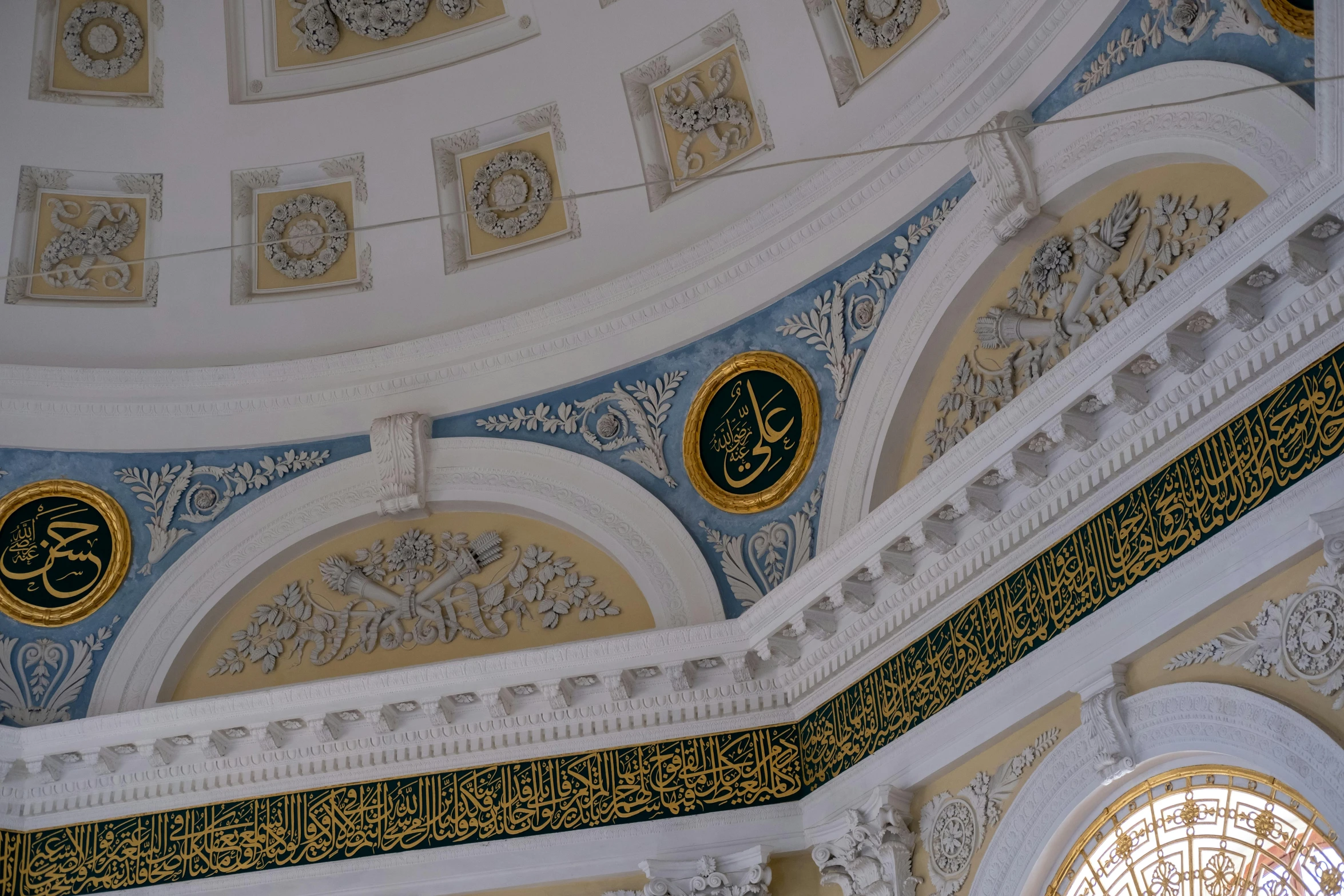 a building with gold, blue and white designs on it