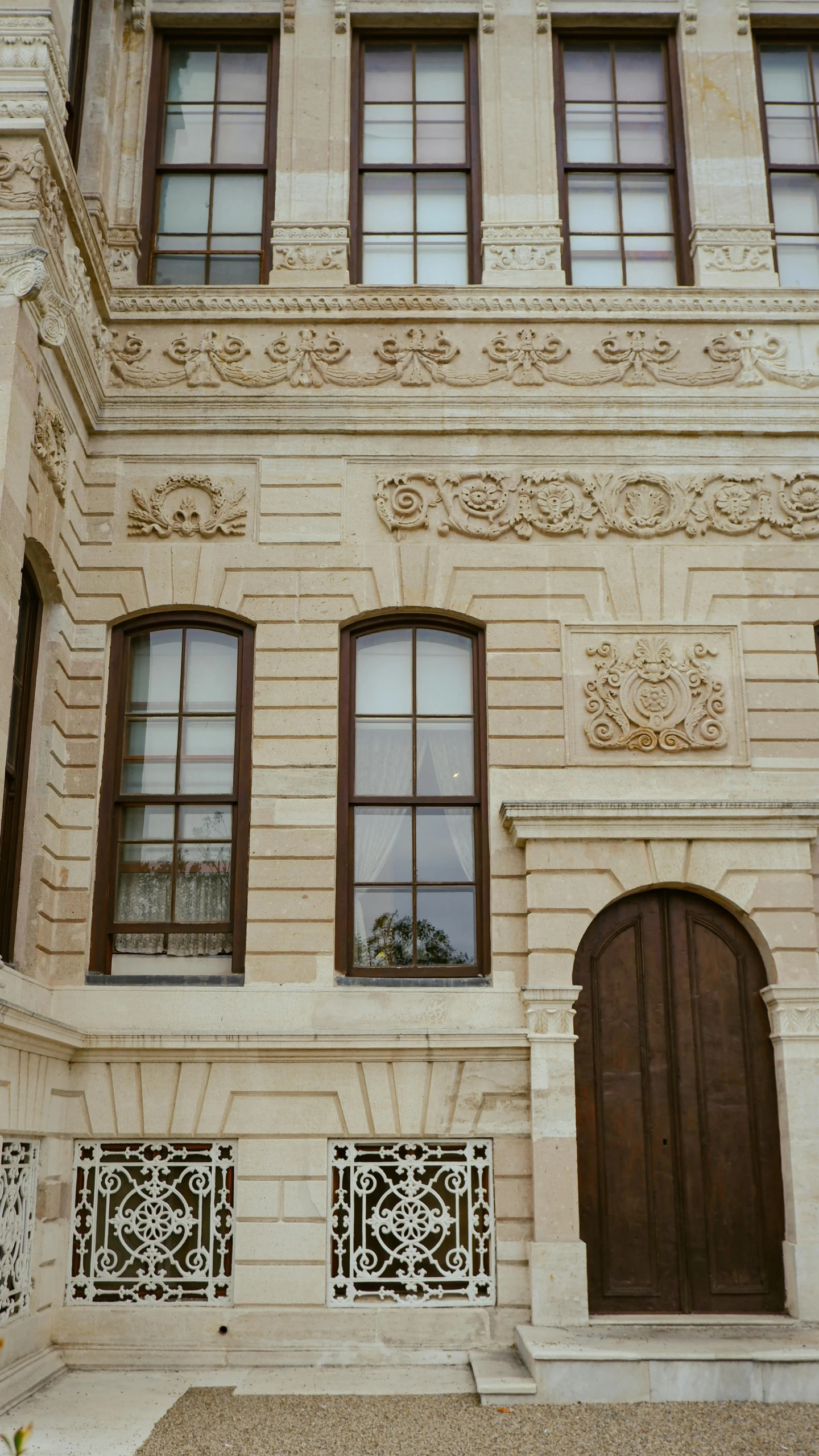 a large building with brown doors and windows