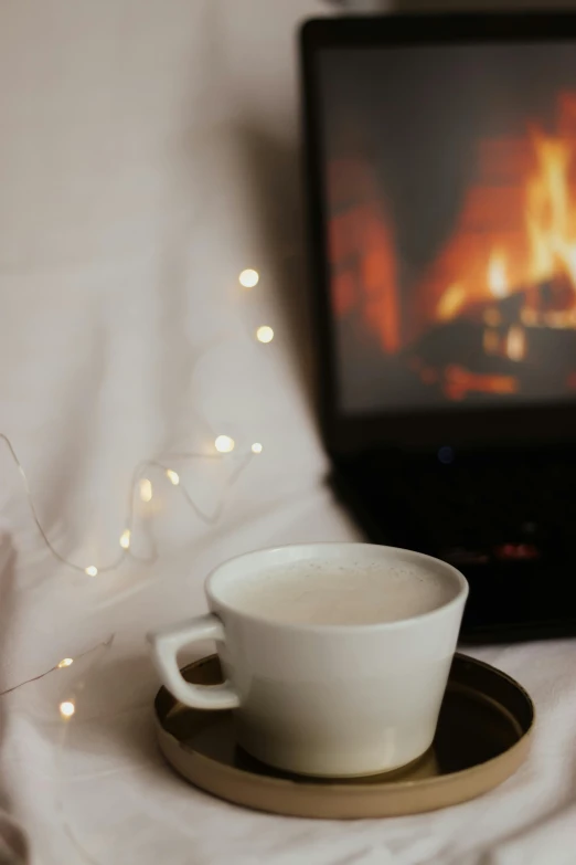 coffee cup and saucer on tray by fireplace