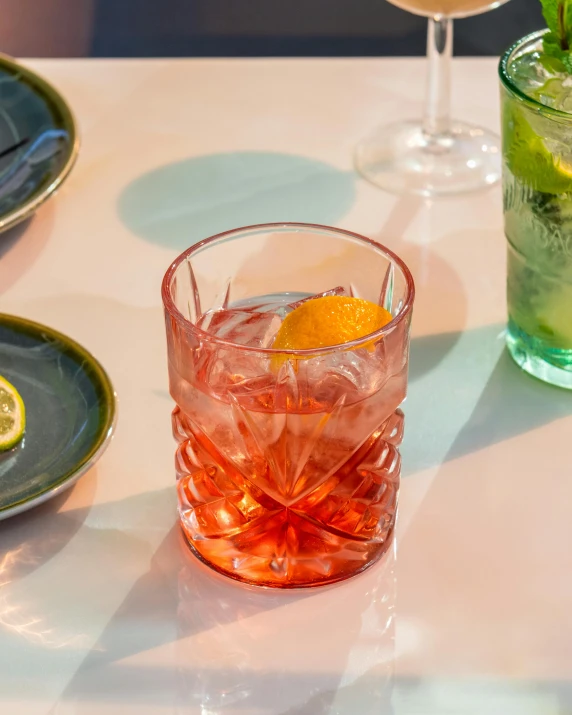 an image of glasses on the table that have food in them