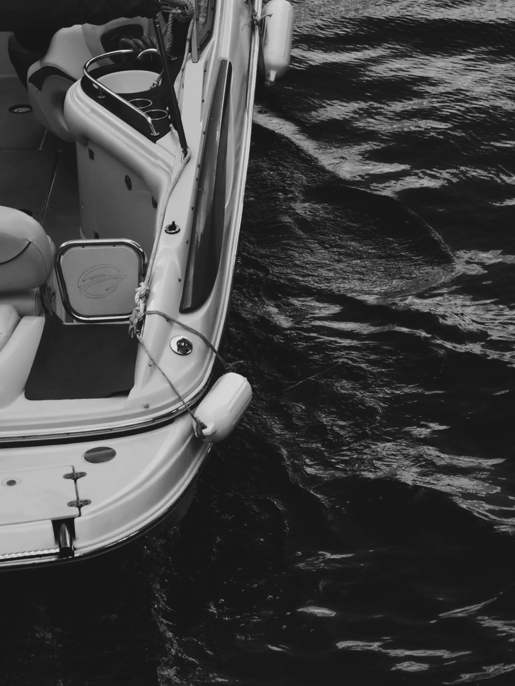 a speed boat with its interior showing is on water