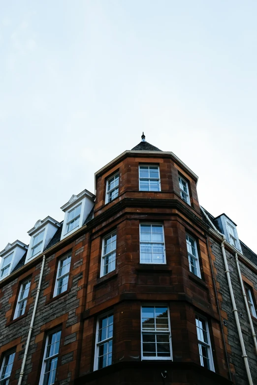 a tall brick building with three story windows