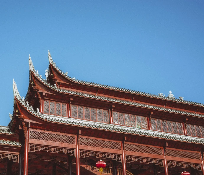 an oriental building that is a red color