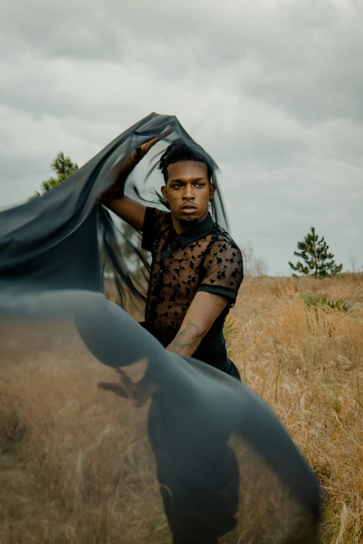 a man who is standing in the grass