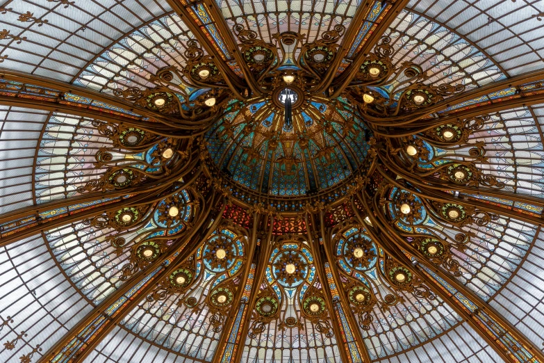 large circular glass chandelier inside of a dome