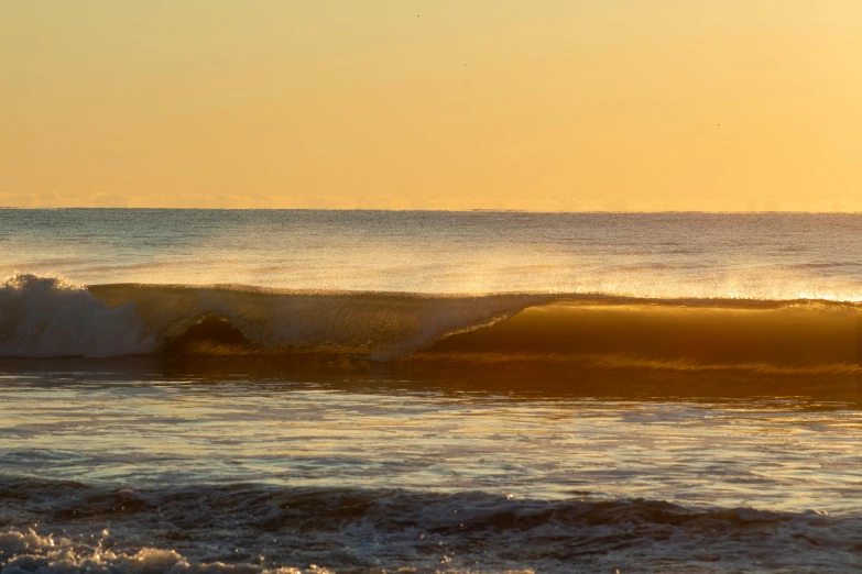 someone riding the ocean waves on their surfboard