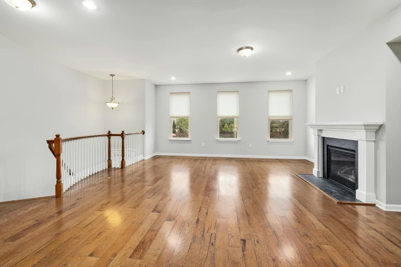 the empty living room has been cleaned and white