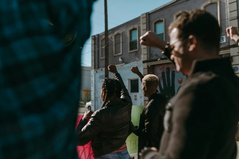 people standing together on a street with no vehicles