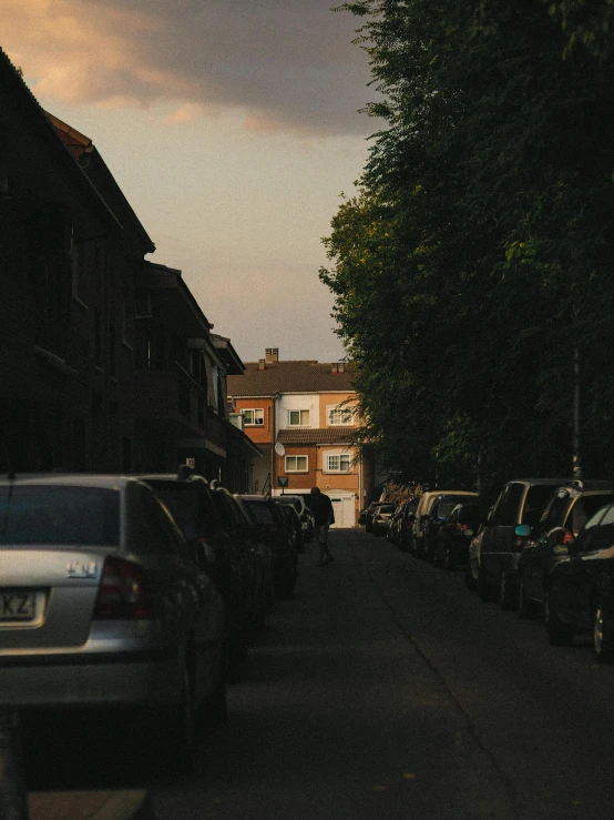a dark and crowded street with several vehicles parked