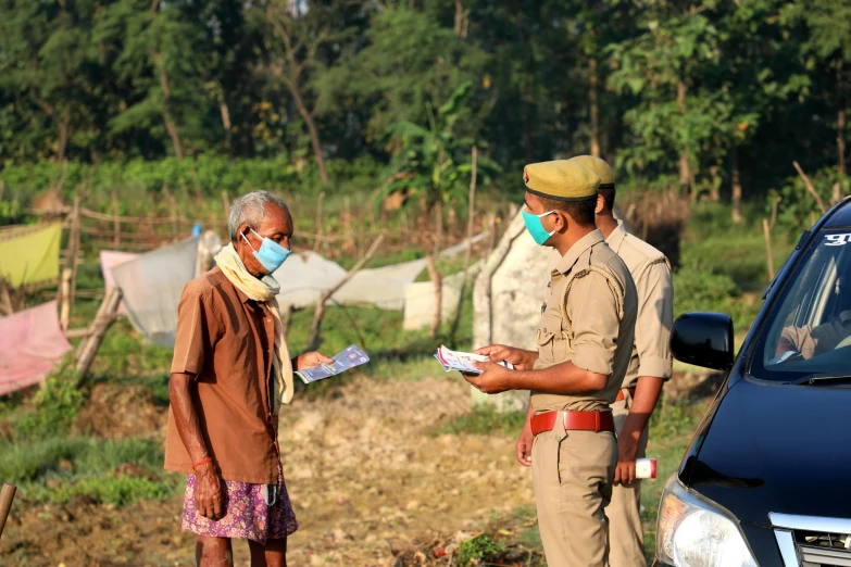 two security officers are talking to one another