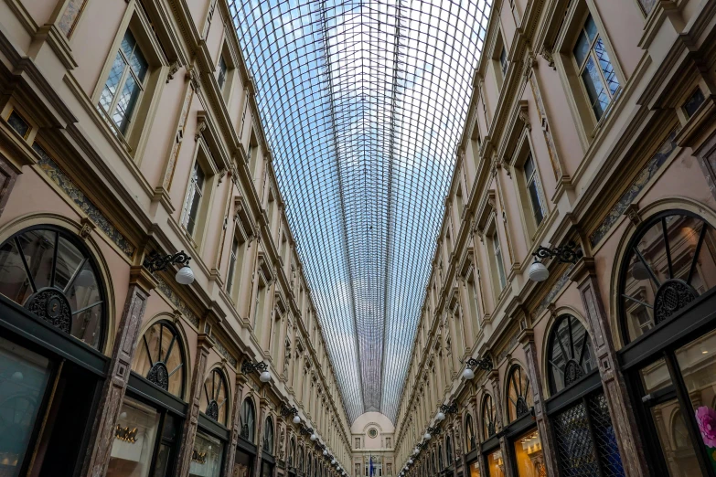 the inside of an empty shopping mall, with high ceilings