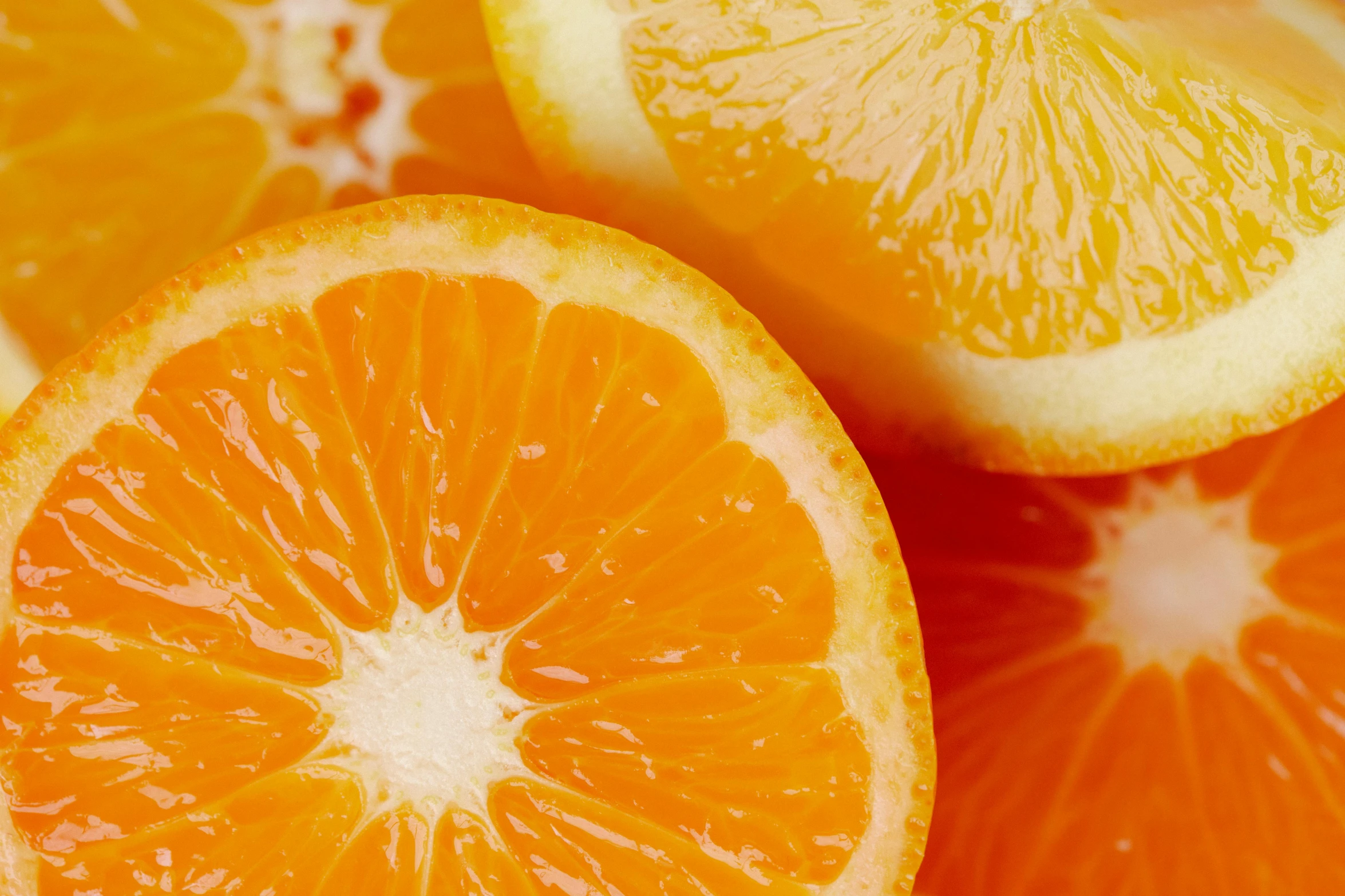 close up of sliced oranges and one in the middle