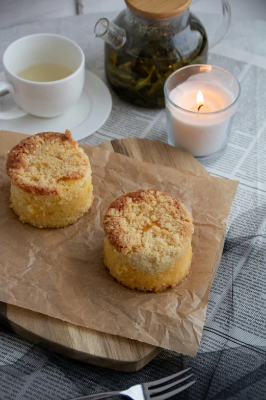 a close up of two biscuits on parchment paper