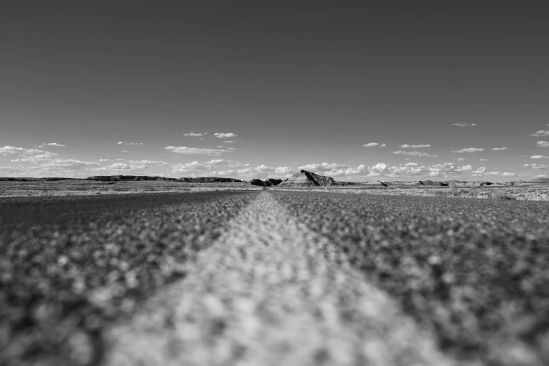 there is a black and white pograph of a road