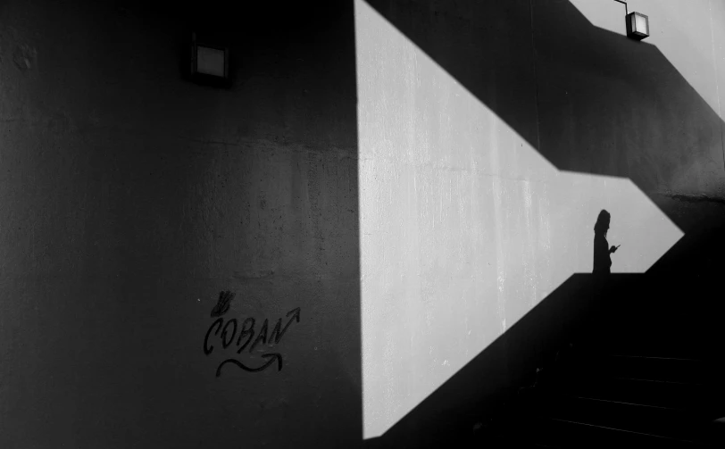 a wall with a clock on it next to a building