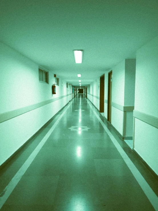 empty hallway in the hospital with lights shining down