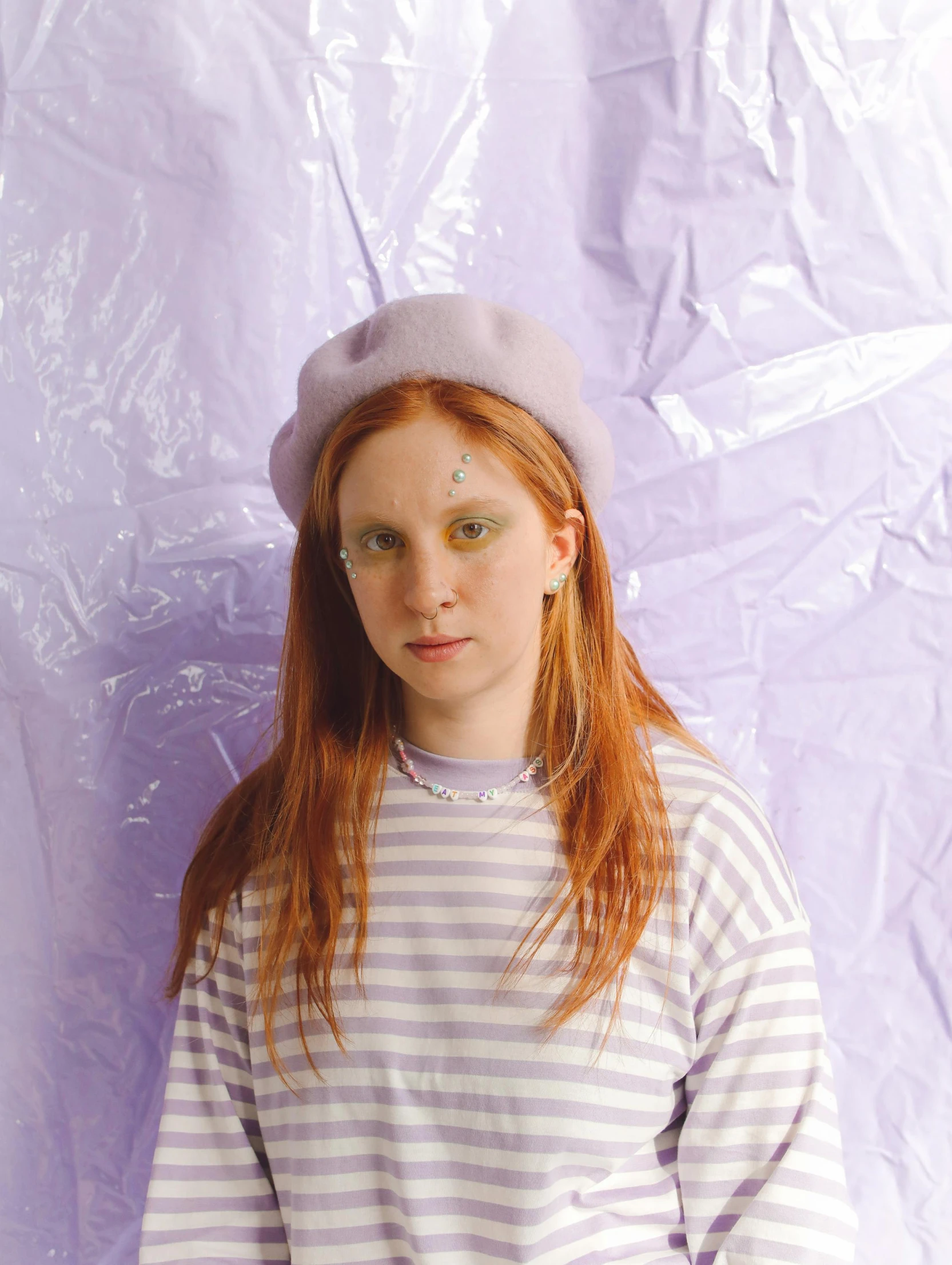 a woman with long red hair and a big hat