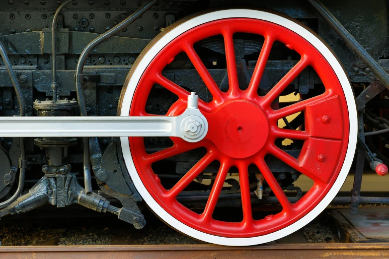 an image of a red and white train wheel