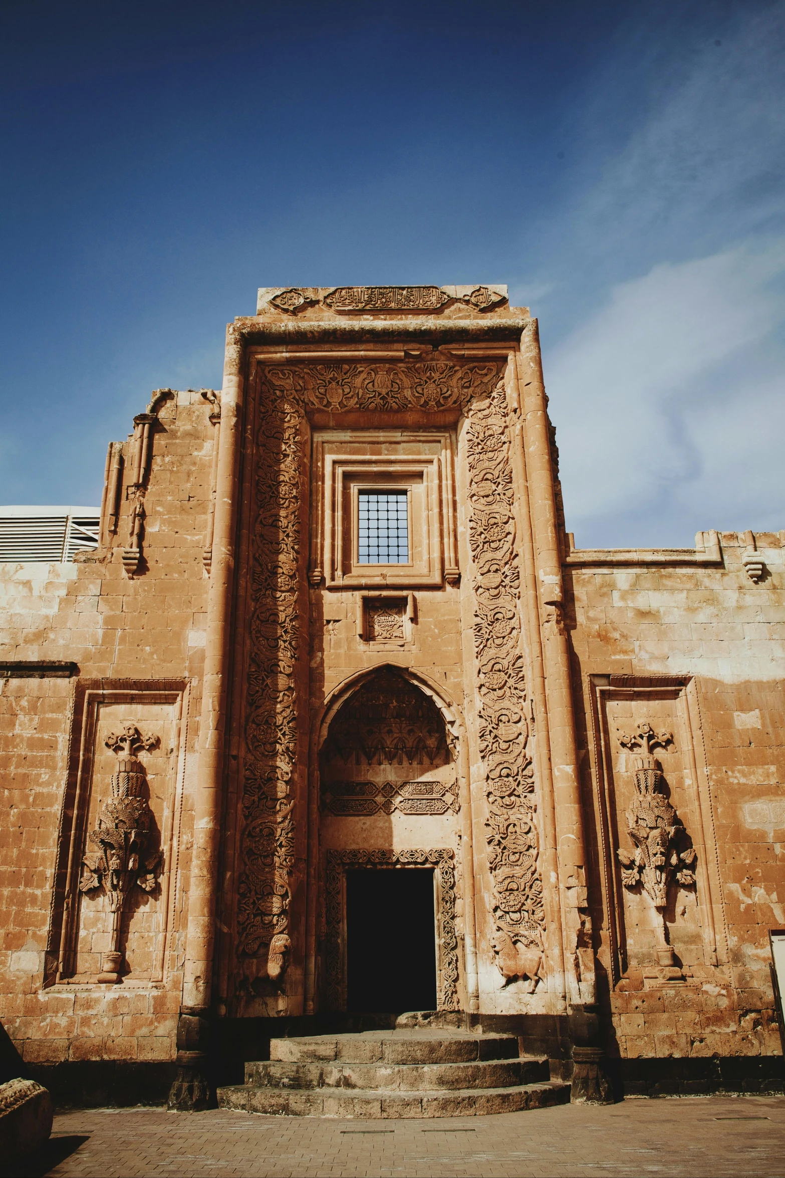 an old building is decorated in stucco and a sky background