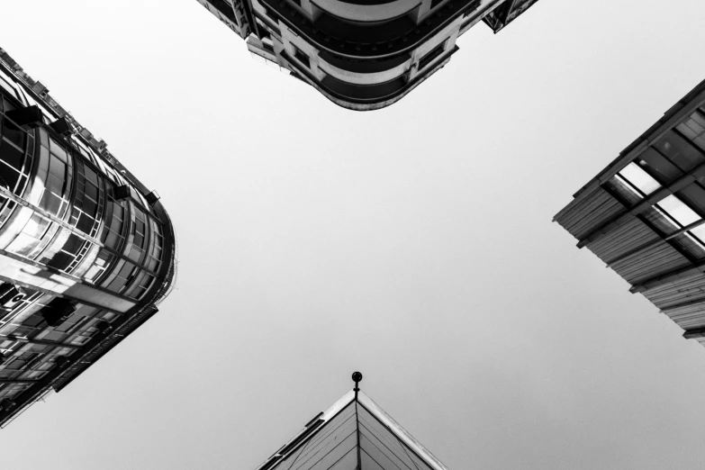 looking up at tall buildings from below