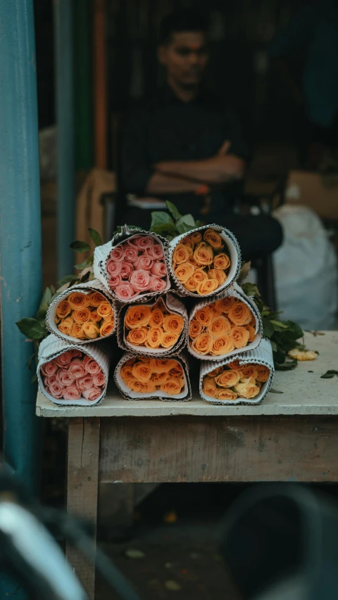 a bunch of fruits in cones sitting on a table