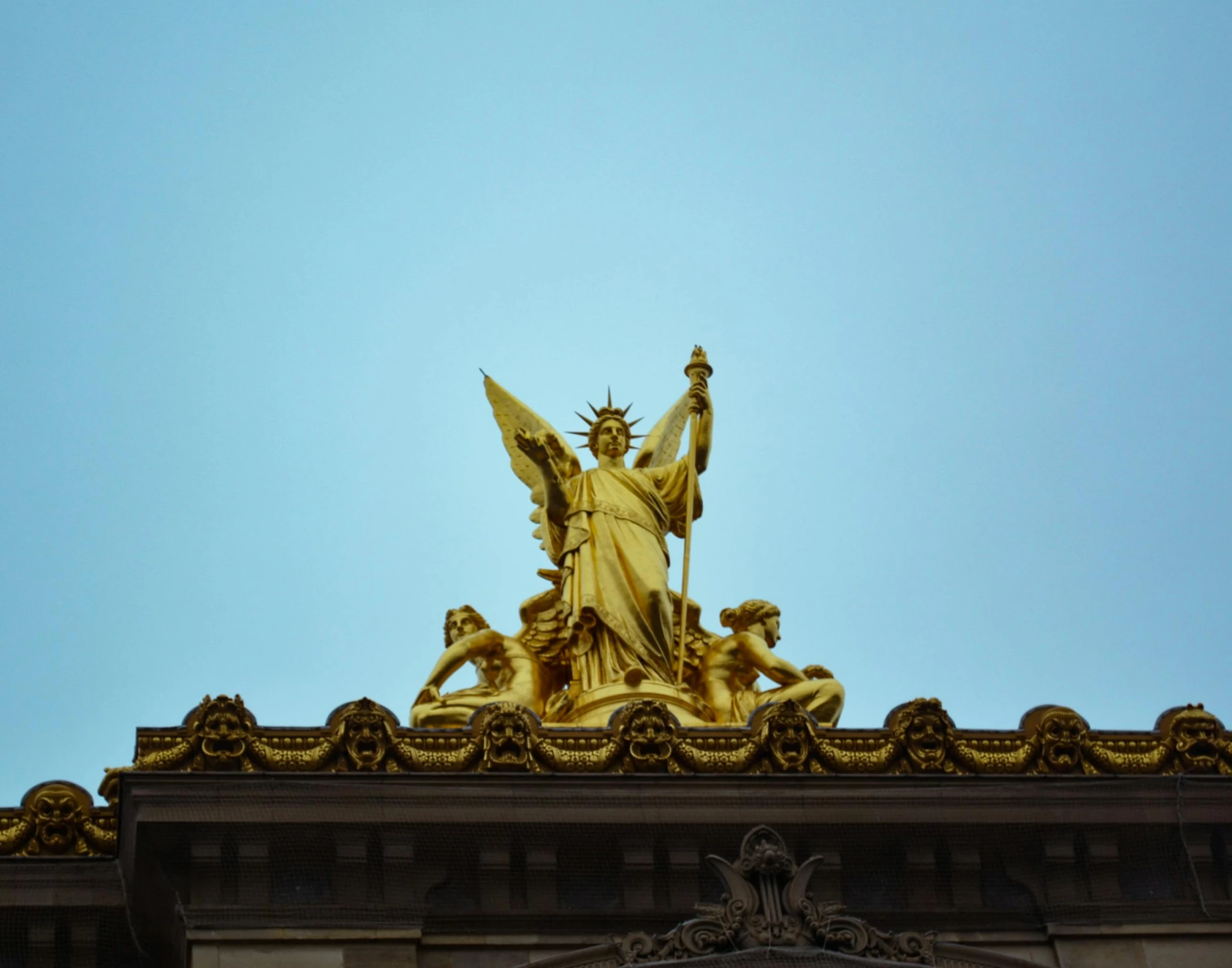 a statue is shown on the top of a building