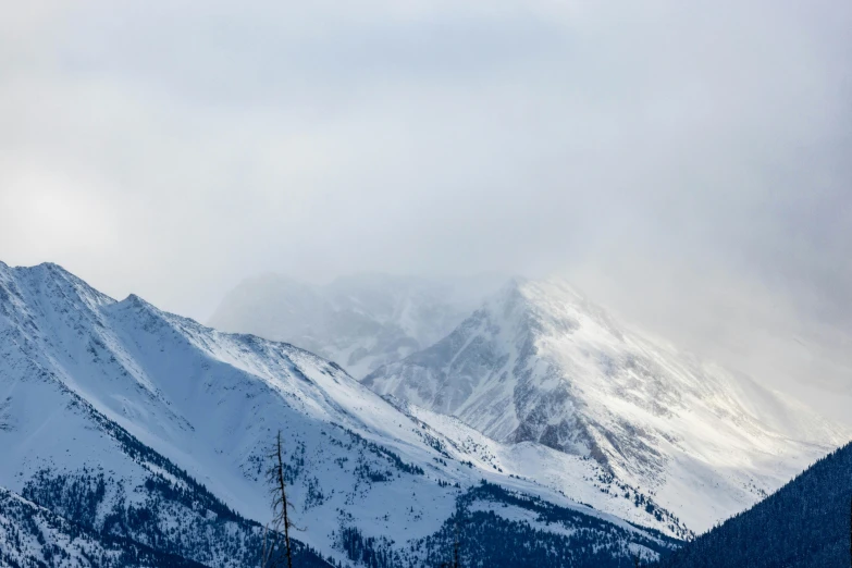 the mountains have some snow and are covered in snow