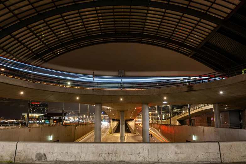 a round building with light streaks on it's wall