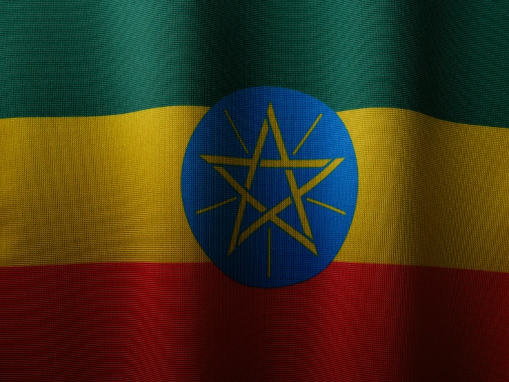 a large ethiopian flag with the sun on it