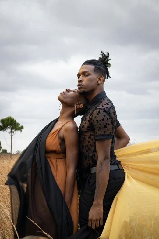 two african american men wearing black and gold