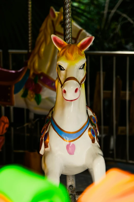 a miniature toy carousel horse on a merry go round