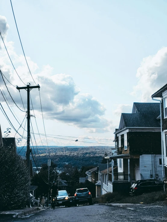 the house is surrounded by other buildings and power lines