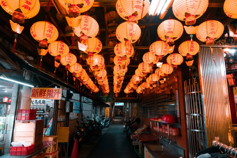 rows of lights hanging from ceiling in asian shop