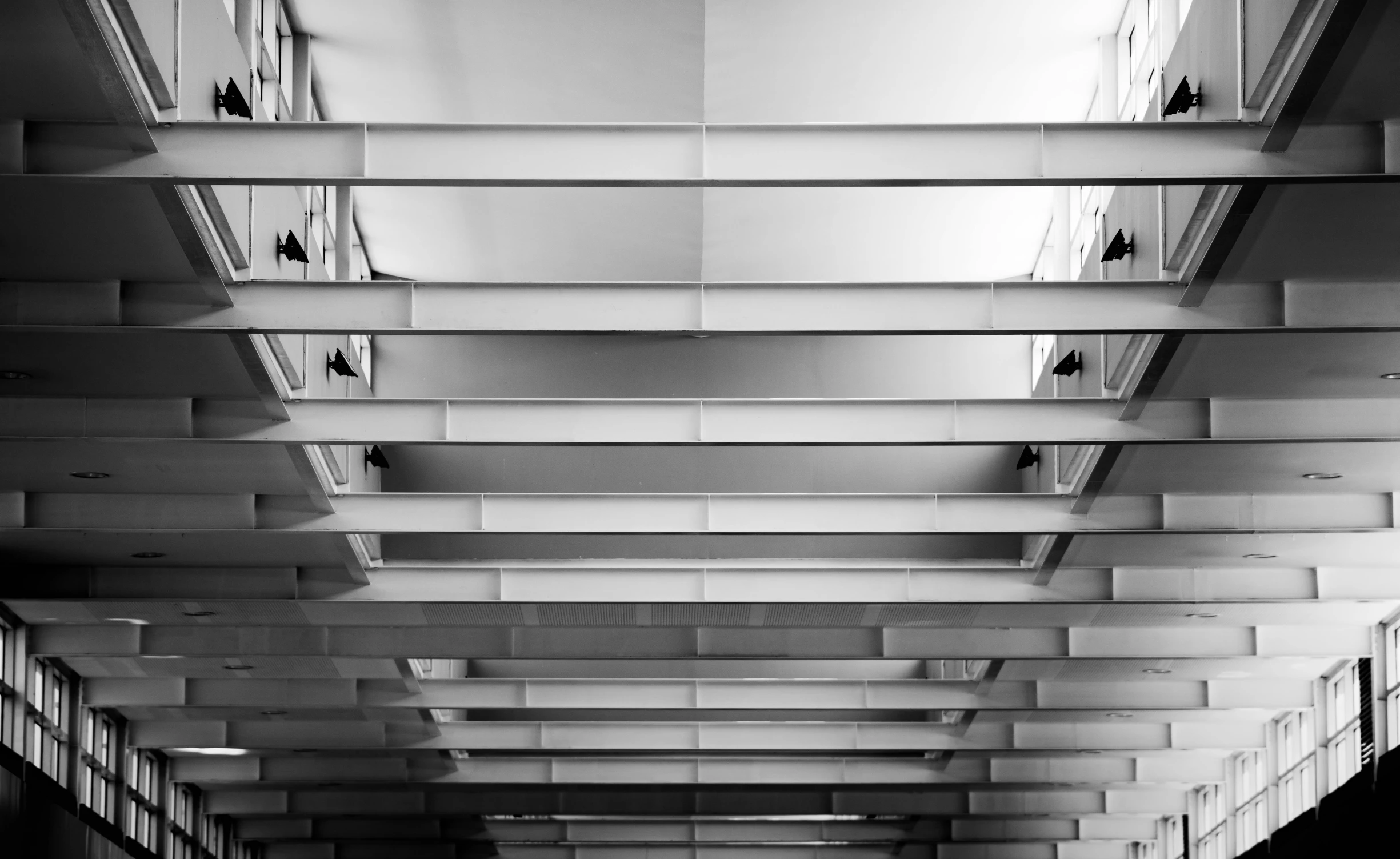 black and white pograph of hallway in building