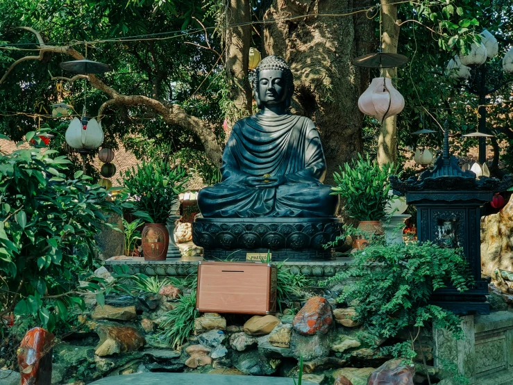 the statue is placed on a ledge in front of some trees