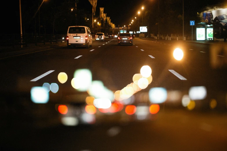 a night scene with blurry street lights and traffic