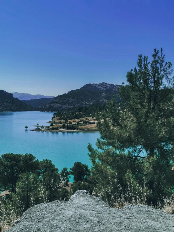 a bench is shown overlooking a large lake