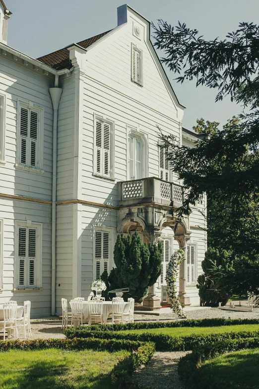 a tall white building with lots of windows