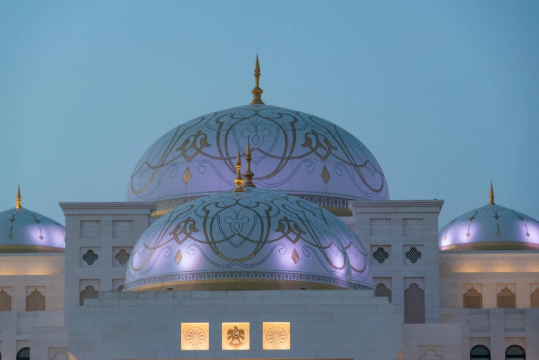 a white building with domes on the side