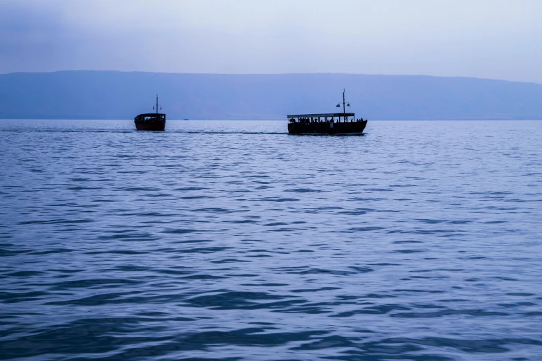 two large boats that are out in the ocean