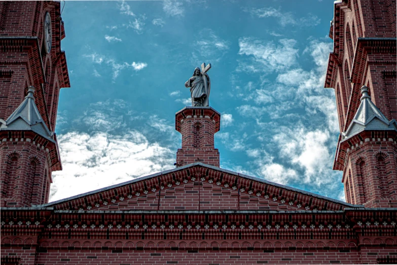 a statue is in the middle of a tall building