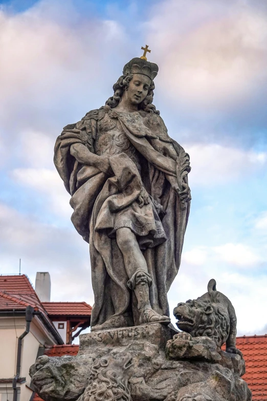 statue of st anthony the baptist outside of a house