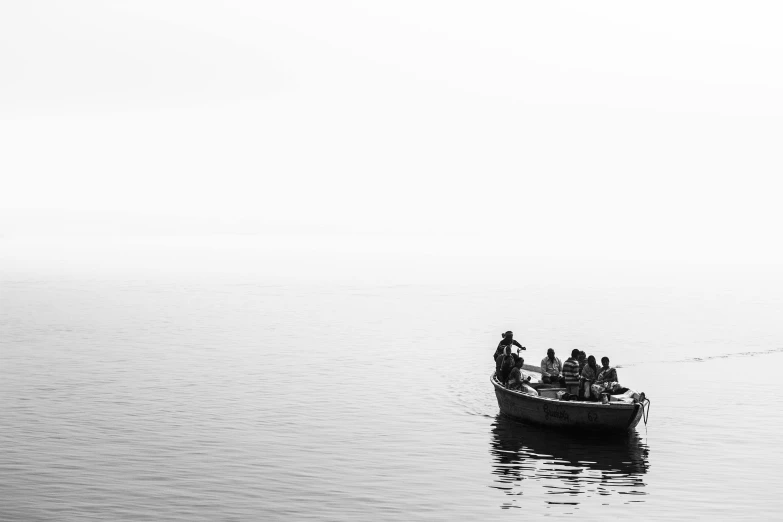 a boat is moving across the water on a foggy day