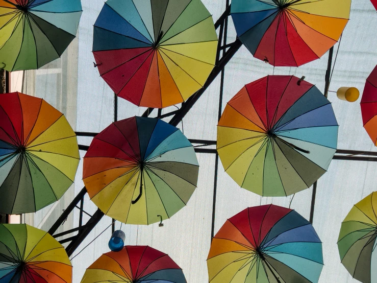 there are many different colors of umbrellas that appear to be on display