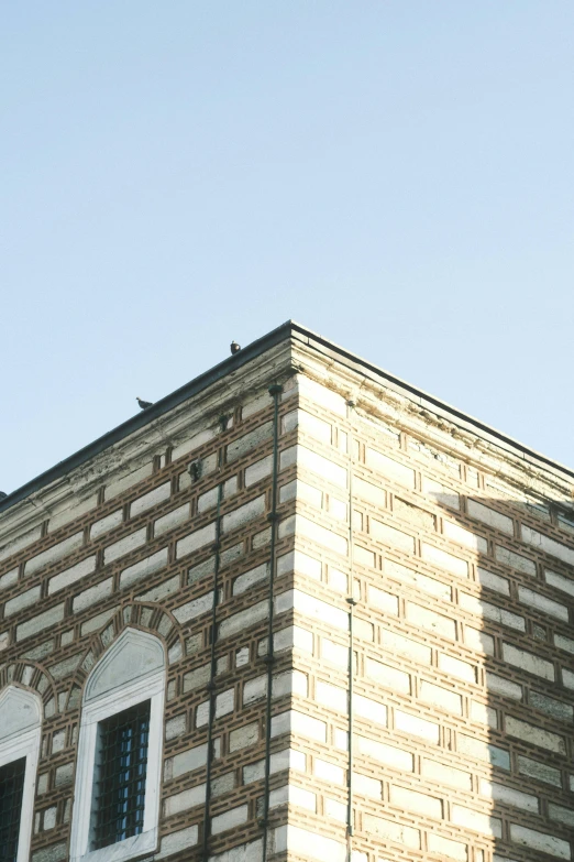 an upward view of a tall brick building