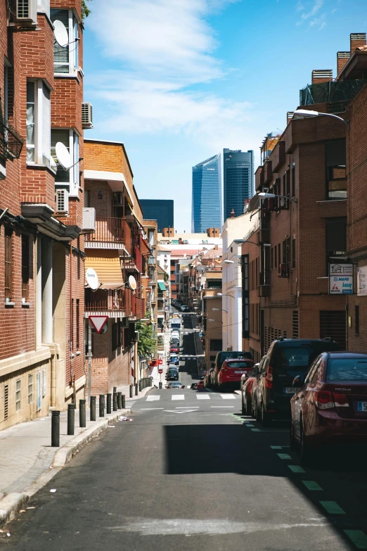 the view down an alleyway in a city