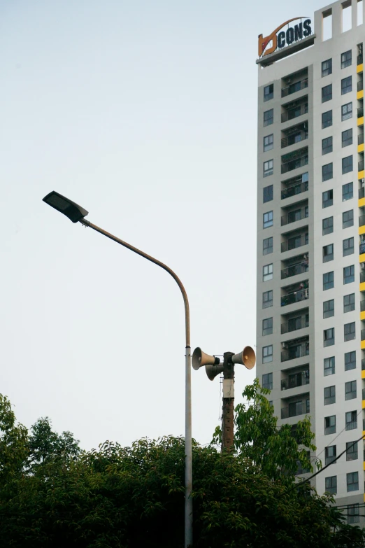 a street light in front of a tall building