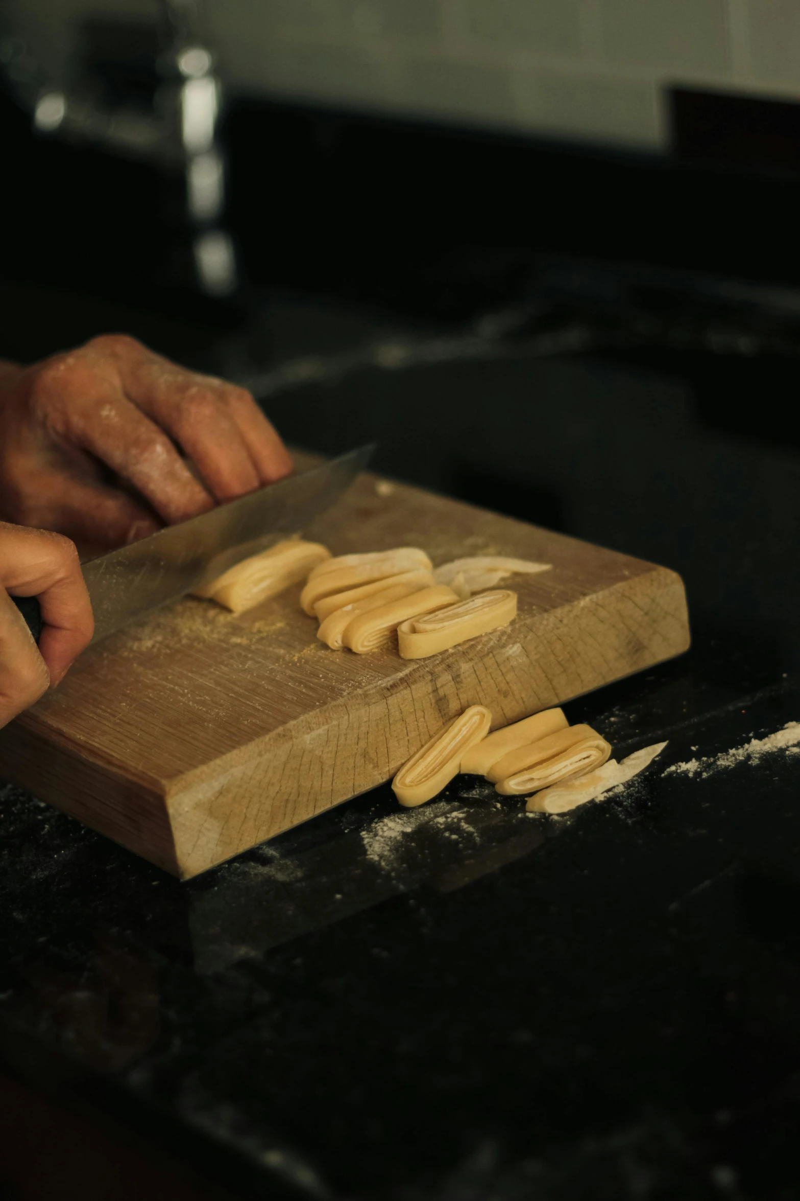 a close up of a person  food on a  board